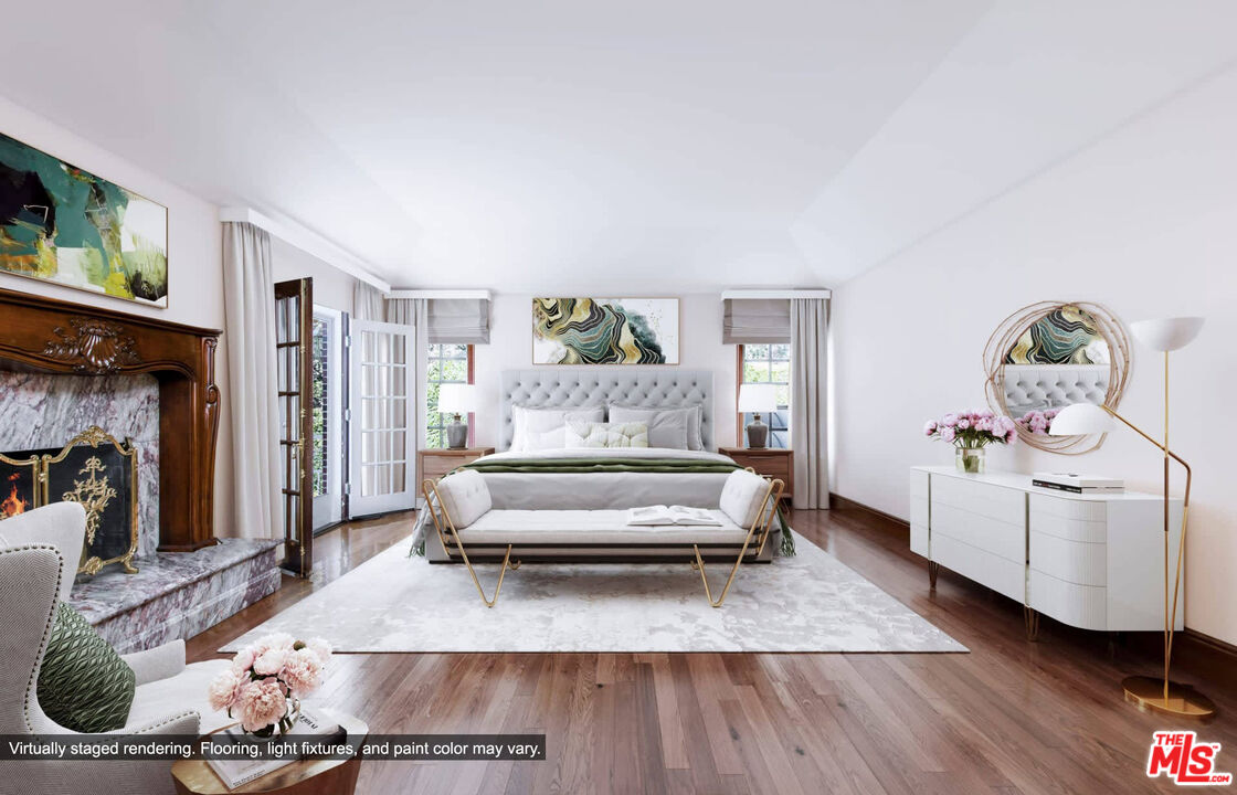 25045 Jim Bridger Road Hidden Hills, CA 91302 - Photo 31 of 52 a living room with furniture and a wooden floor