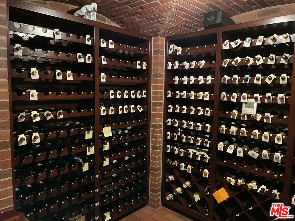 25045 Jim Bridger Road Hidden Hills, CA 91302 - Photo 34 of 52 a room with a book shelf