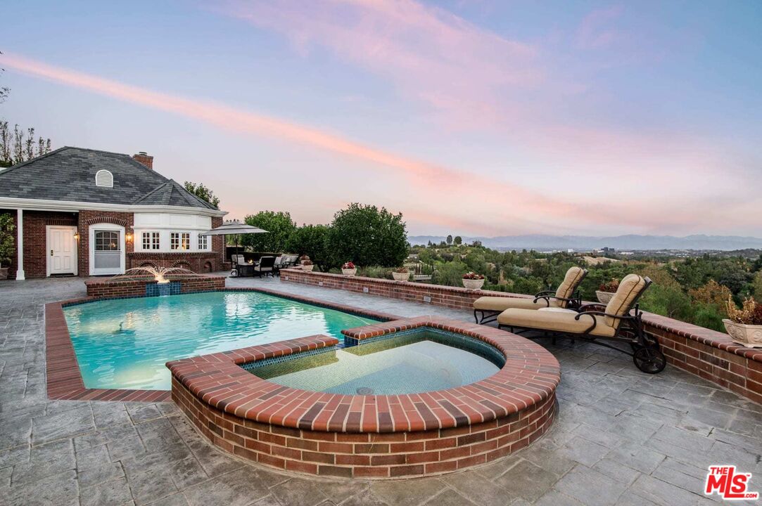25045 Jim Bridger Road Hidden Hills, CA 91302 - Photo 35 of 52 an outdoor space with lounge chairs