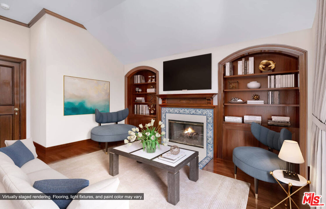 25045 Jim Bridger Road Hidden Hills, CA 91302 - Photo 37 of 52 a living room with furniture and a fireplace