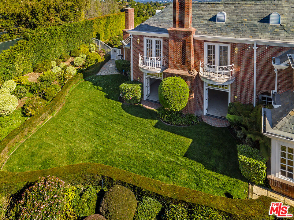 25045 Jim Bridger Road Hidden Hills, CA 91302 - Photo 42 of 52 an aerial view of a house having patio