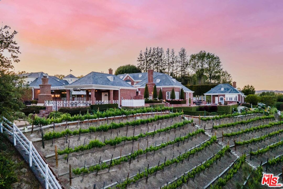 25045 Jim Bridger Road Hidden Hills, CA 91302 - Photo 44 of 52 a front view of a house with a yard