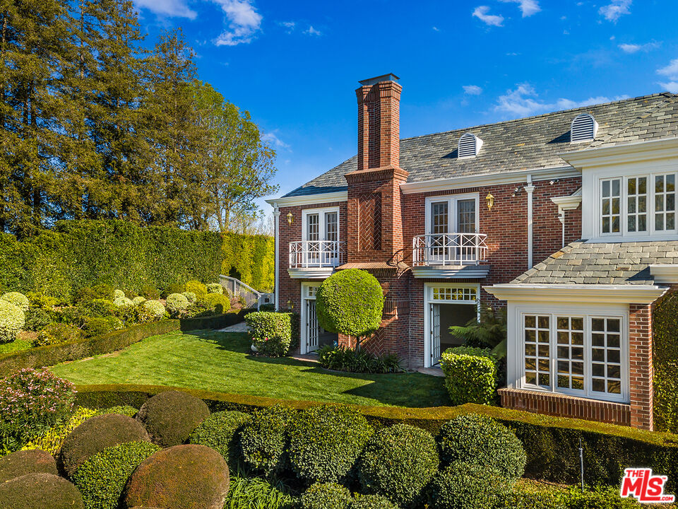 25045 Jim Bridger Road Hidden Hills, CA 91302 - Photo 48 of 52 a front view of a house with garden