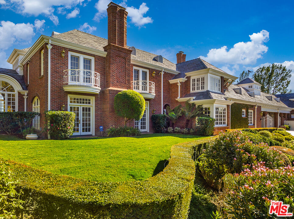 25045 Jim Bridger Road Hidden Hills, CA 91302 - Photo 50 of 52 a front view of a house with a yard