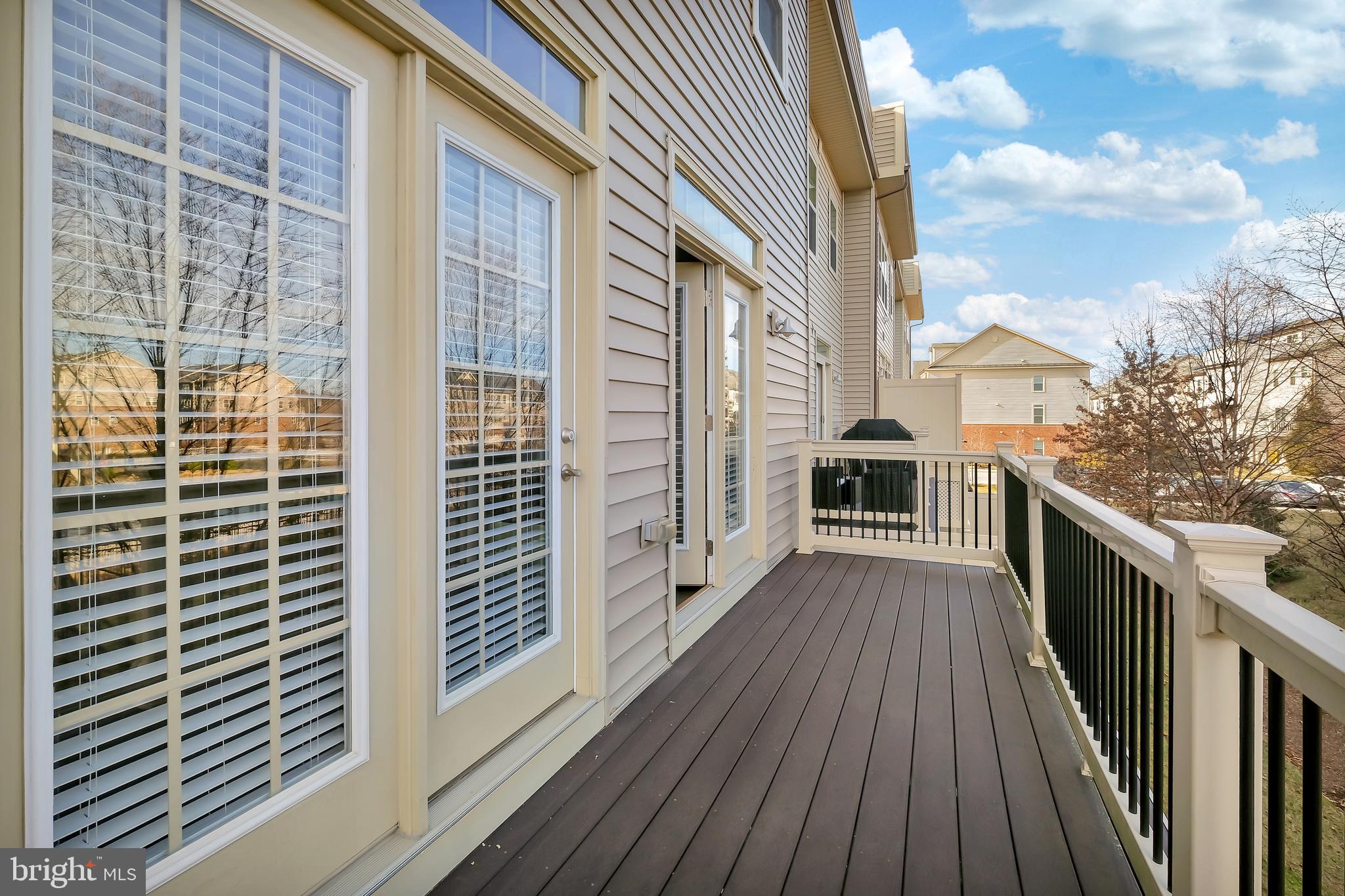 2918 Middleham Court Hanover, MD 21076 - Photo 12 of 37 a view of balcony with wooden floor and fence
