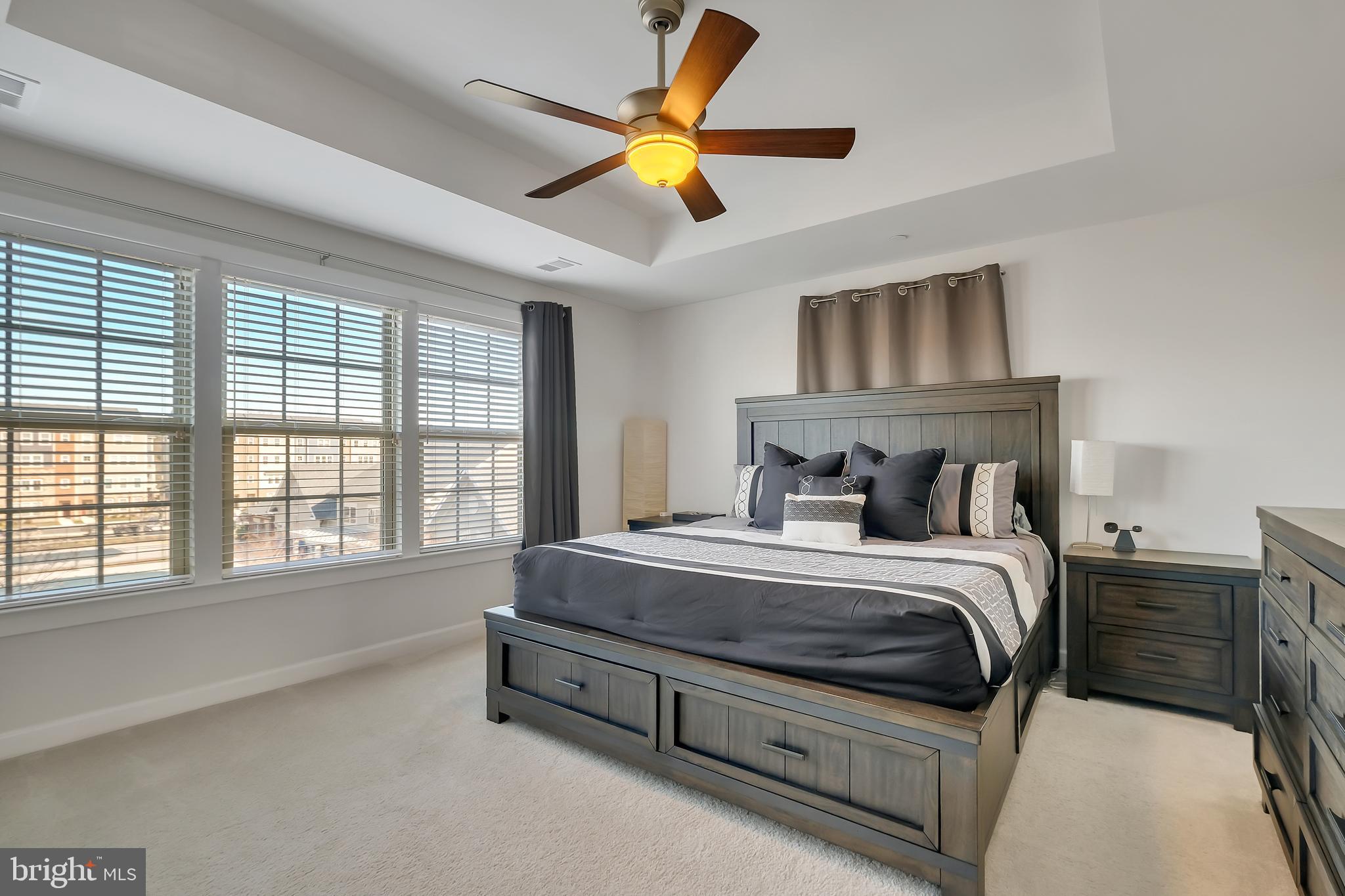 2918 Middleham Court Hanover, MD 21076 - Photo 13 of 37 a bedroom with a bed and a chandelier