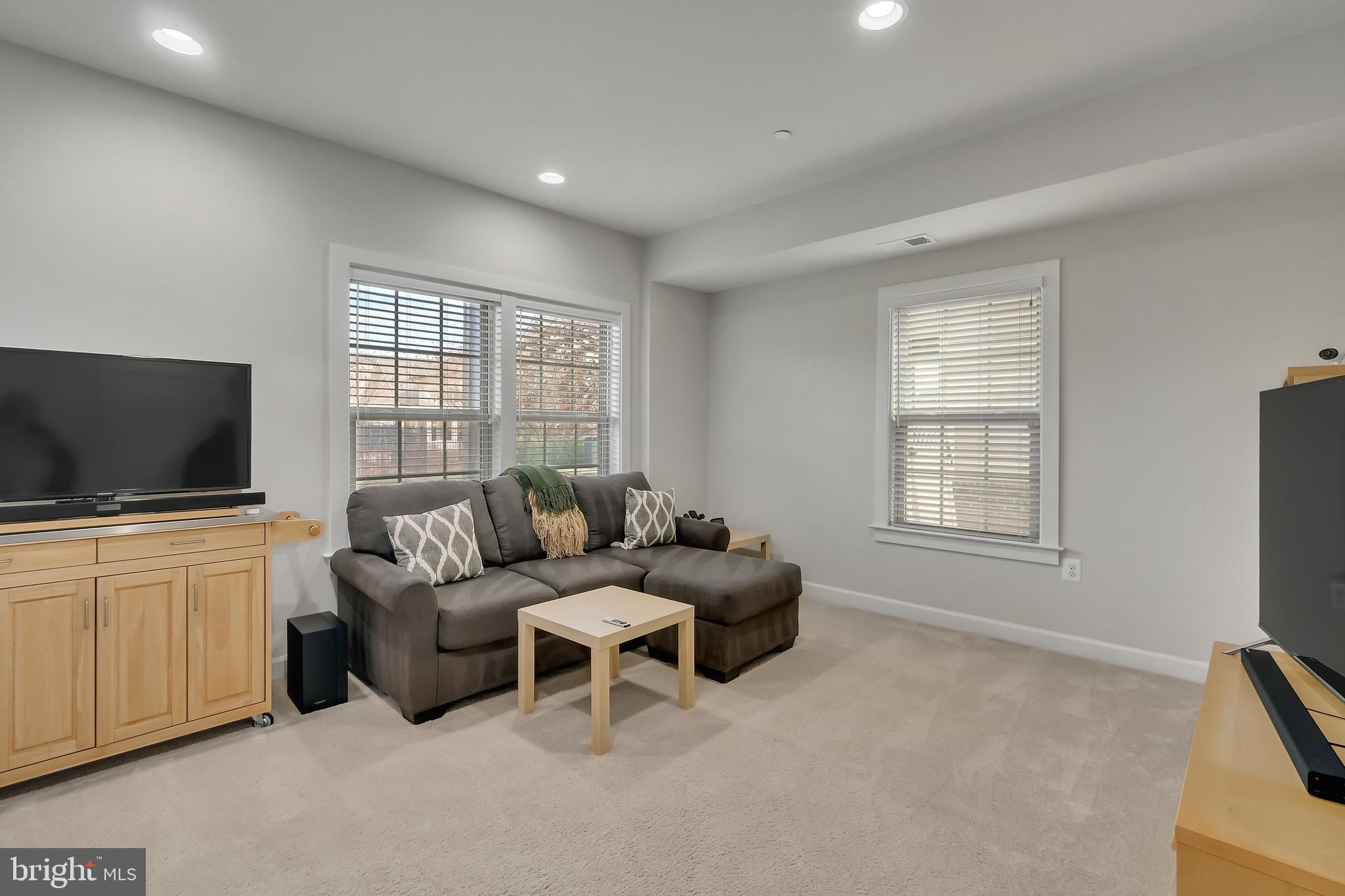2918 Middleham Court Hanover, MD 21076 - Photo 28 of 37 a living room with furniture and a flat screen tv