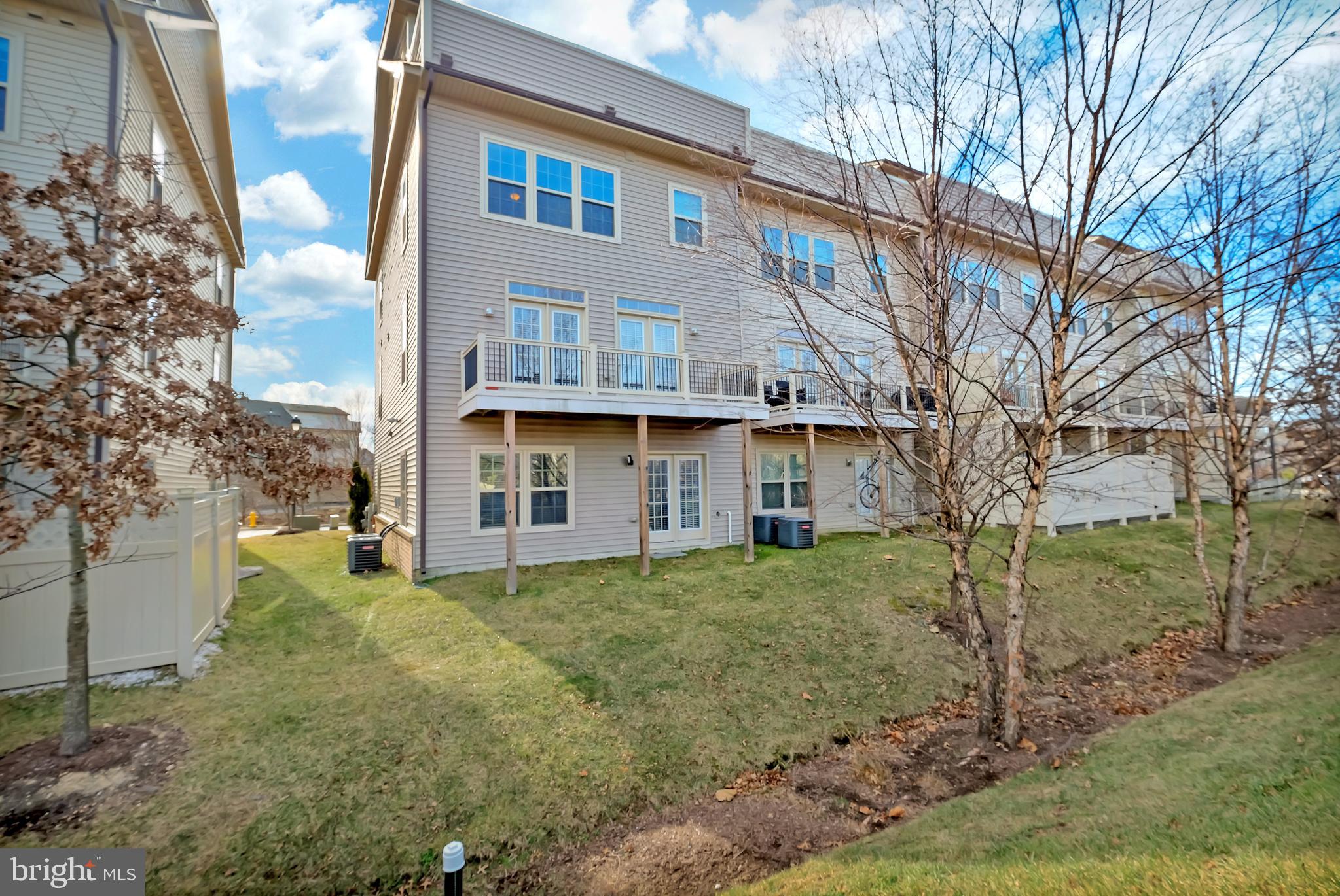 2918 Middleham Court Hanover, MD 21076 - Photo 31 of 37 a view of a house with a yard
