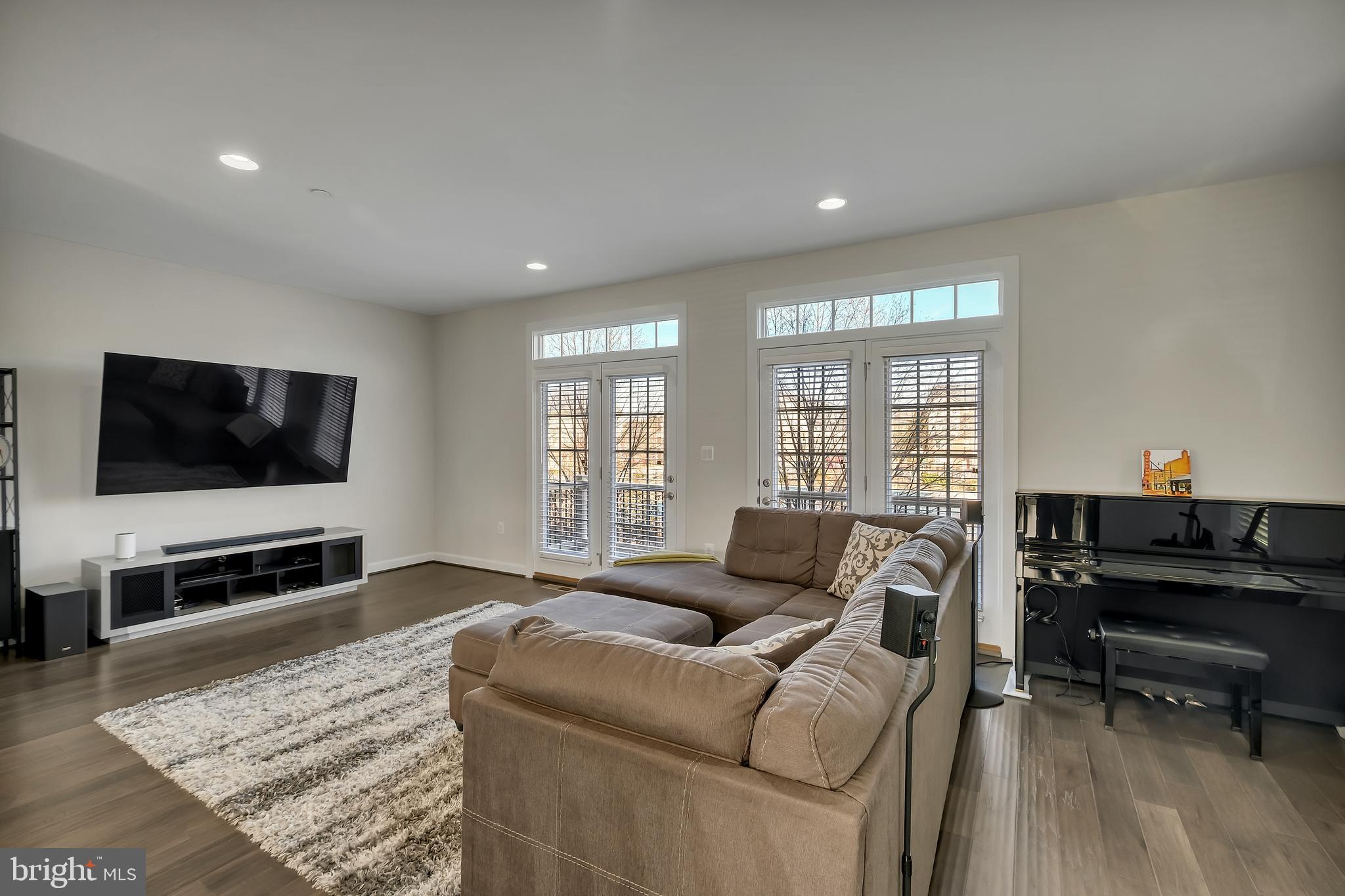 2918 Middleham Court Hanover, MD 21076 - Photo 9 of 37 a living room with furniture and a flat screen tv