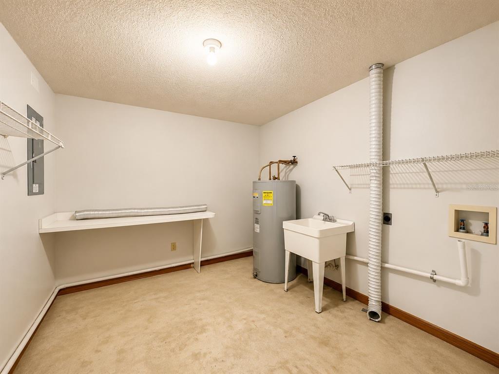 7119 Immokalee Road Keystone Heights, FL 32656 - Photo 36 of 50 a room with a chair and white walls