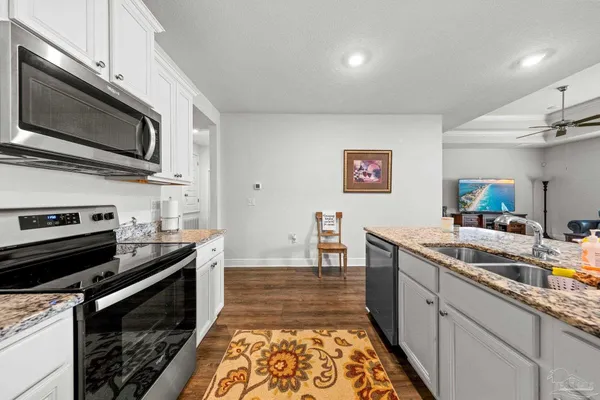 a kitchen with a stove and a microwave