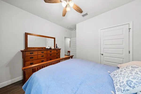 a room with a dresser and a mirror