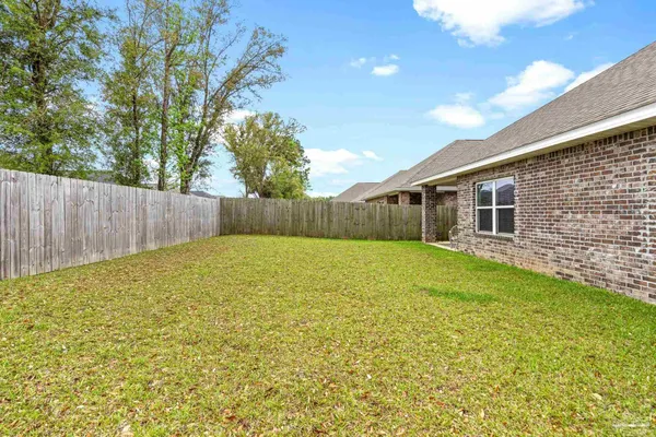 a view of a back yard of the house