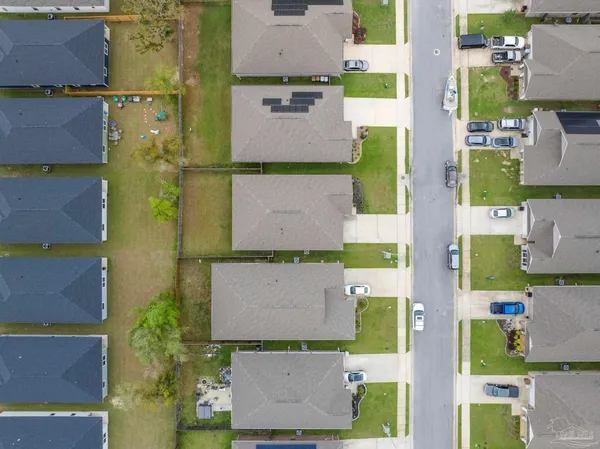 an aerial view of residential houses with outdoor space