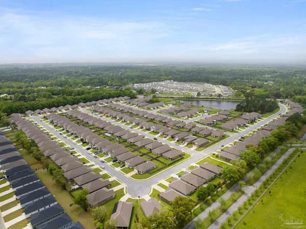 a picture of a room with a white cabinet and a microwave
