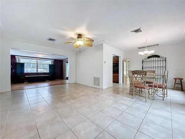 a view of dining room with furniture and chandelier