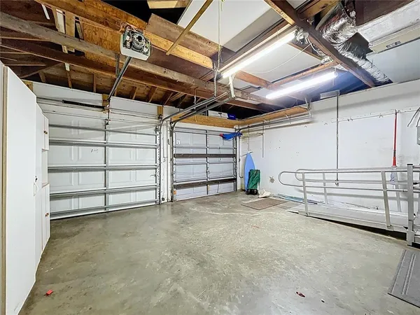 a view of a garage room with an empty space