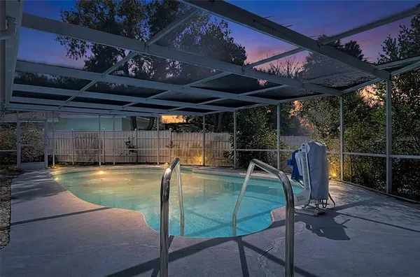 a view of a swimming pool with a patio