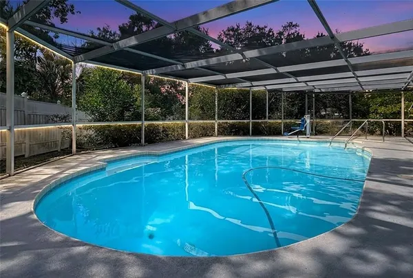 a view of a swimming pool with a patio