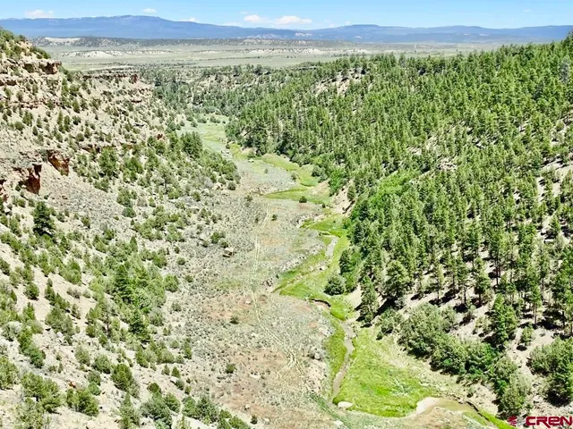 a view of a field with an outdoor space