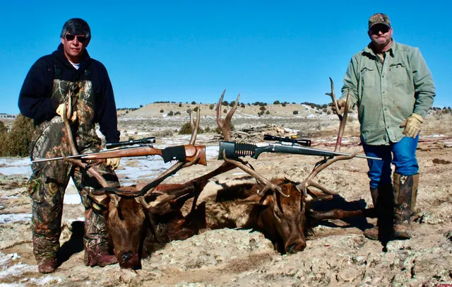a front view of a house with a yard covered with snow in center