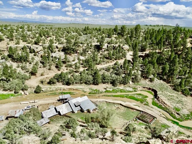 a view of outdoor space with a table and chairs