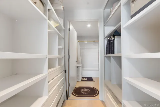 a bathroom with a sink and a washer dryer