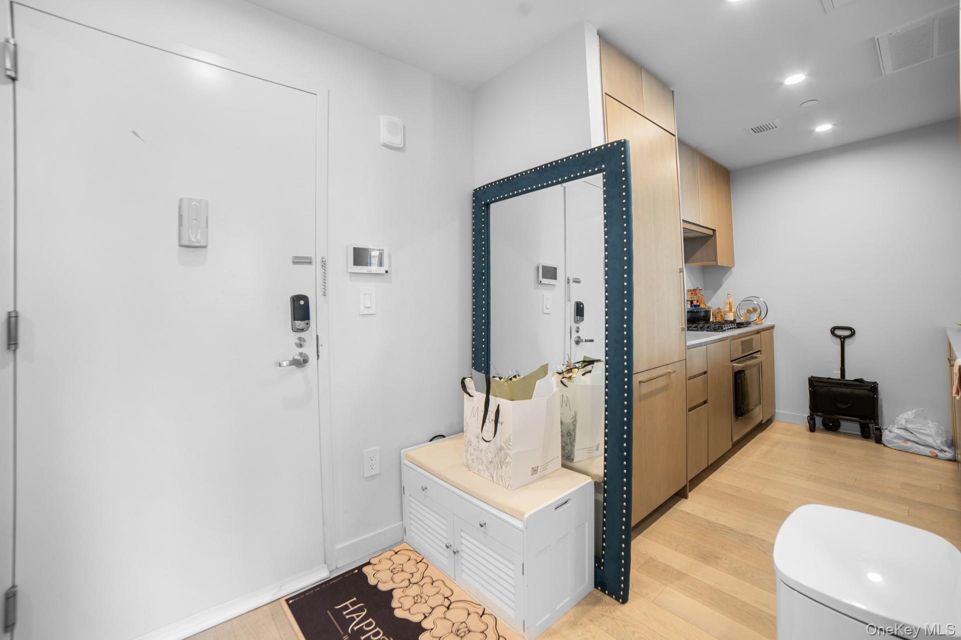 131-02 40th Road, Unit 12G Queens, NY 11354 - Photo 6 of 18 a bathroom with a sink a toilet and shower