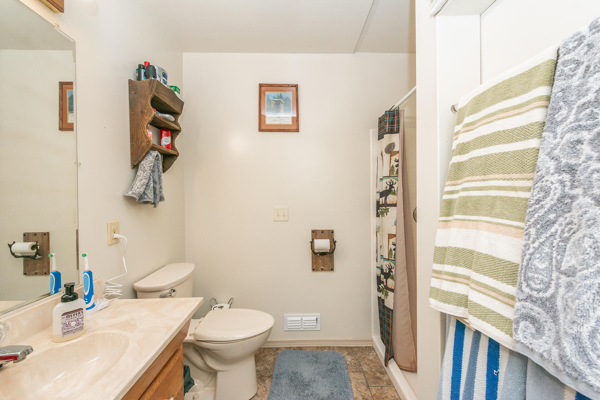 851 Mountain Aire Road Trinity Center, CA 96091 - Photo 41 of 54 a bathroom with a sink toilet and a mirror