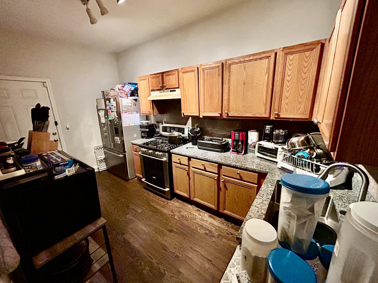 5714 South Prairie Avenue Chicago, IL 60637 - Photo 13 of 39 a kitchen with a refrigerator stove and sink