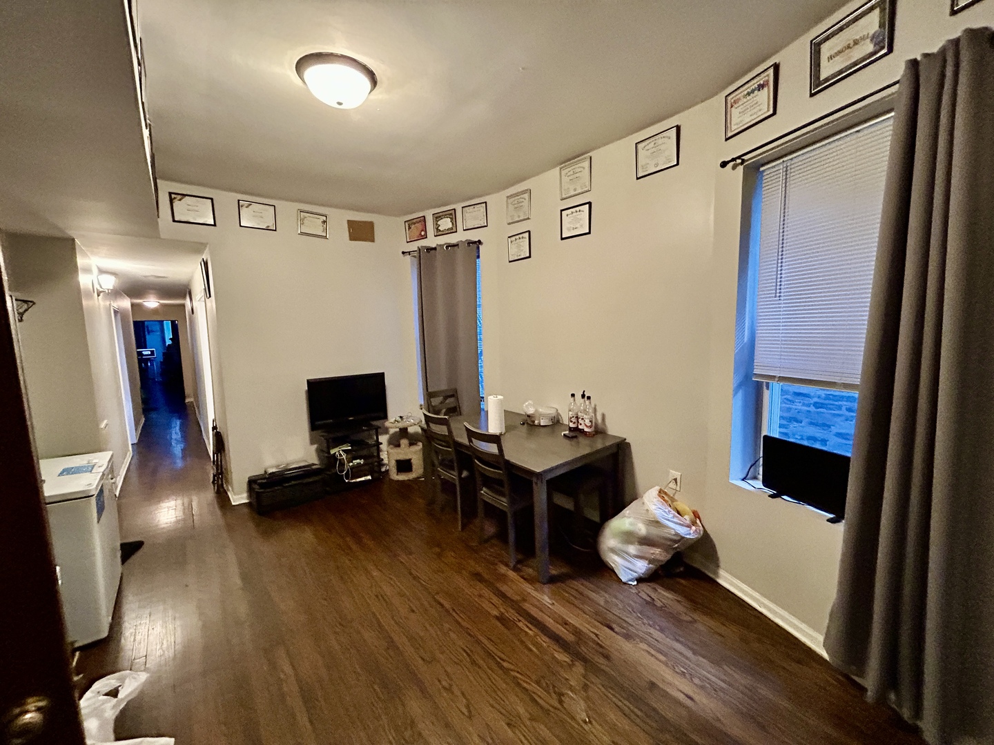 5714 South Prairie Avenue Chicago, IL 60637 - Photo 14 of 39 a living room with furniture and a flat screen tv