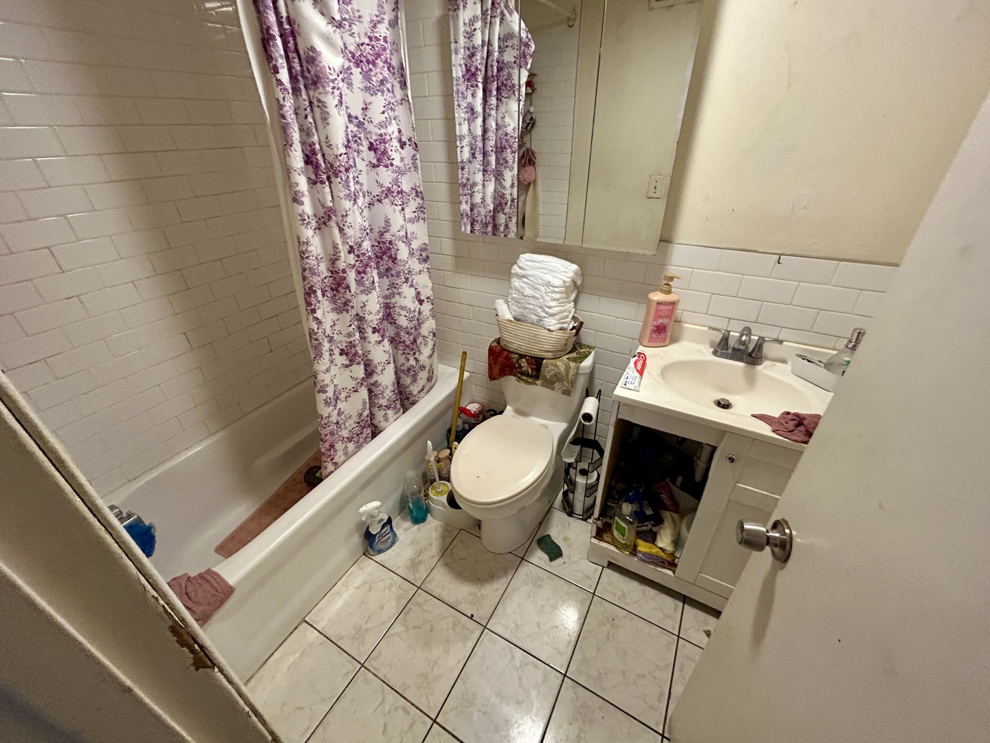 5714 South Prairie Avenue Chicago, IL 60637 - Photo 31 of 39 a white toilet sitting next to a shower curtain