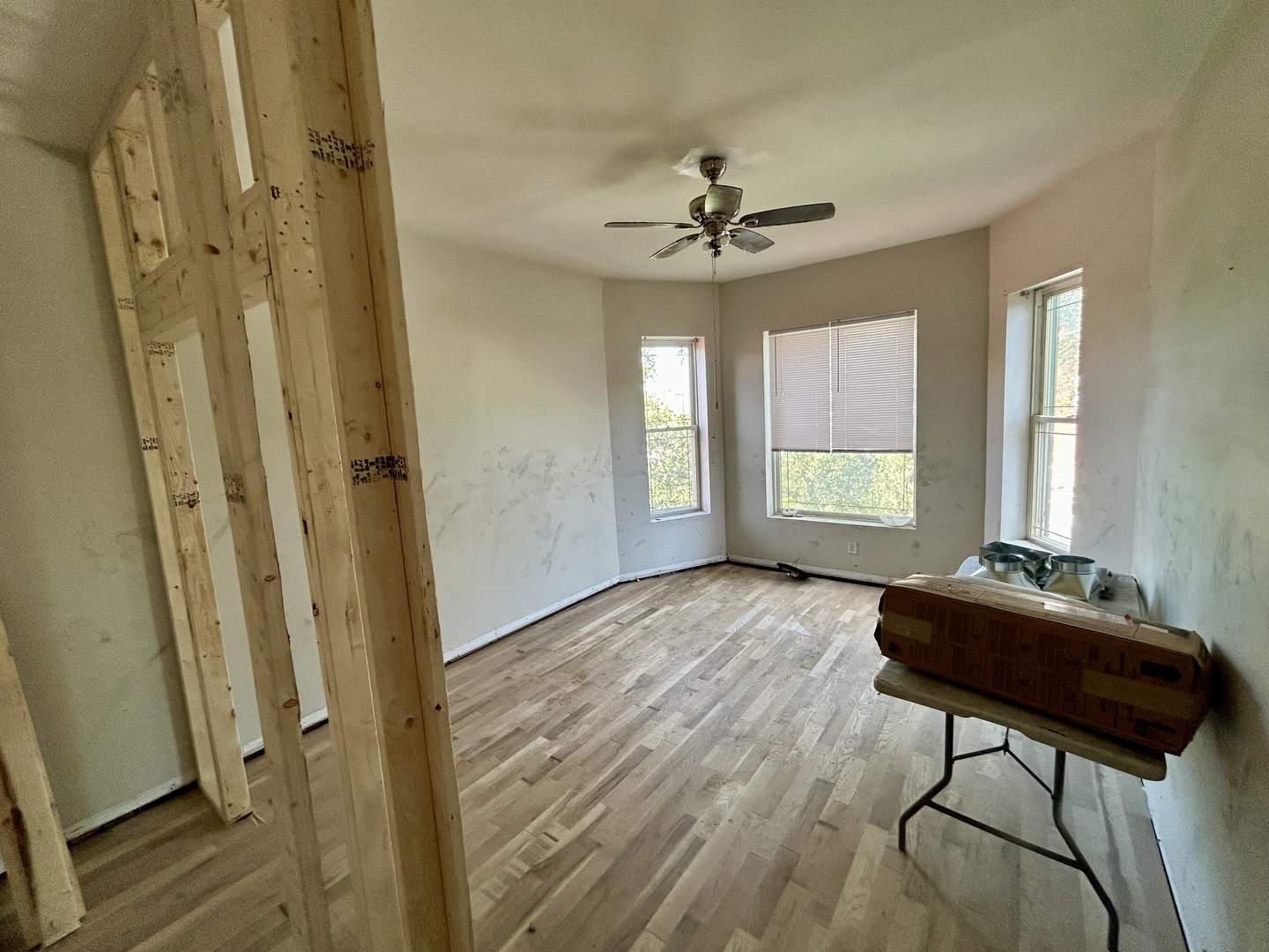 5714 South Prairie Avenue Chicago, IL 60637 - Photo 8 of 39 a view of a livingroom with a hardwood floor and a ceiling fan
