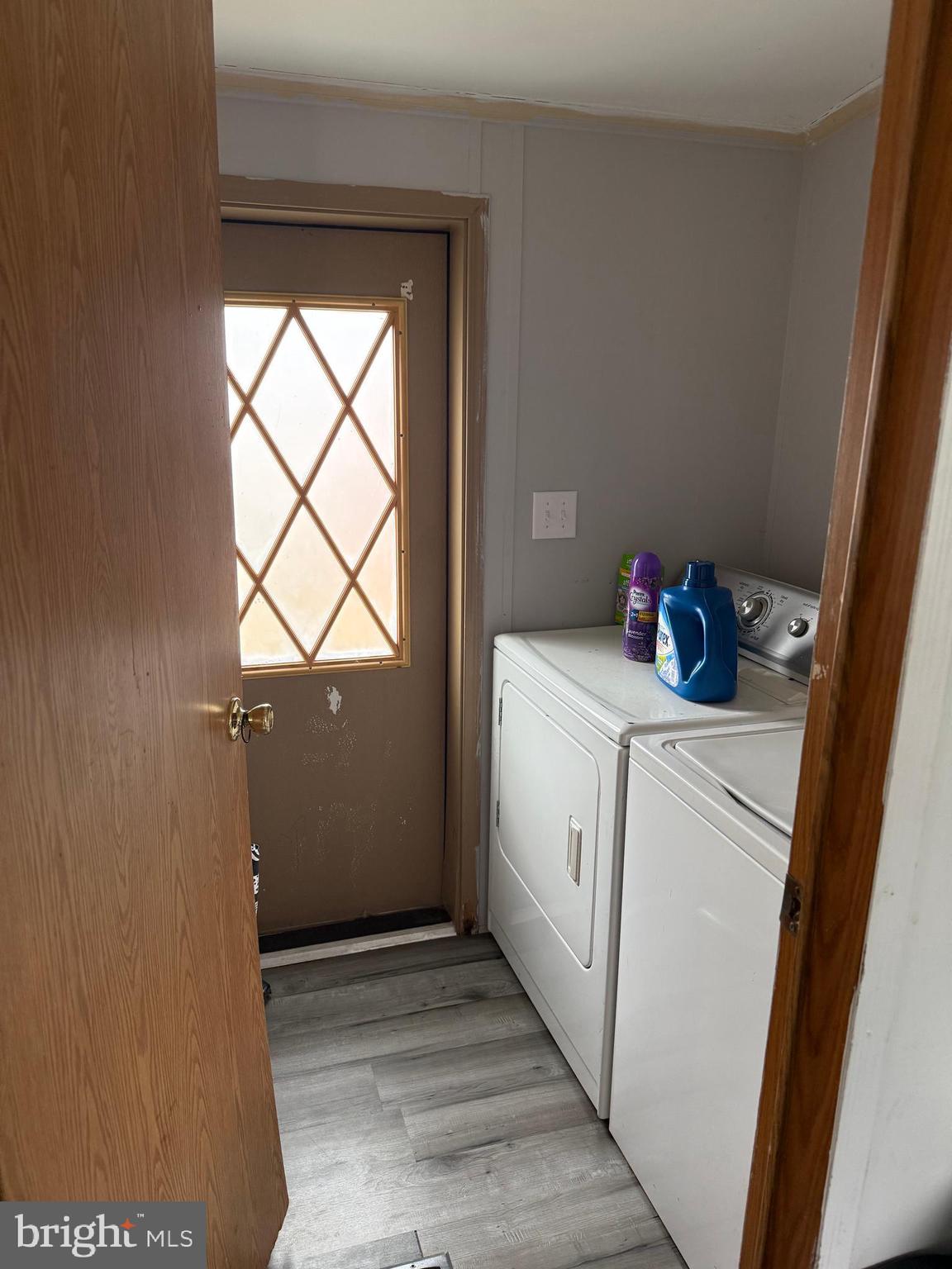 938 Decoy Way, Unit A161 Bear, DE 19701 - Photo 16 of 17 a room with dryer and washer