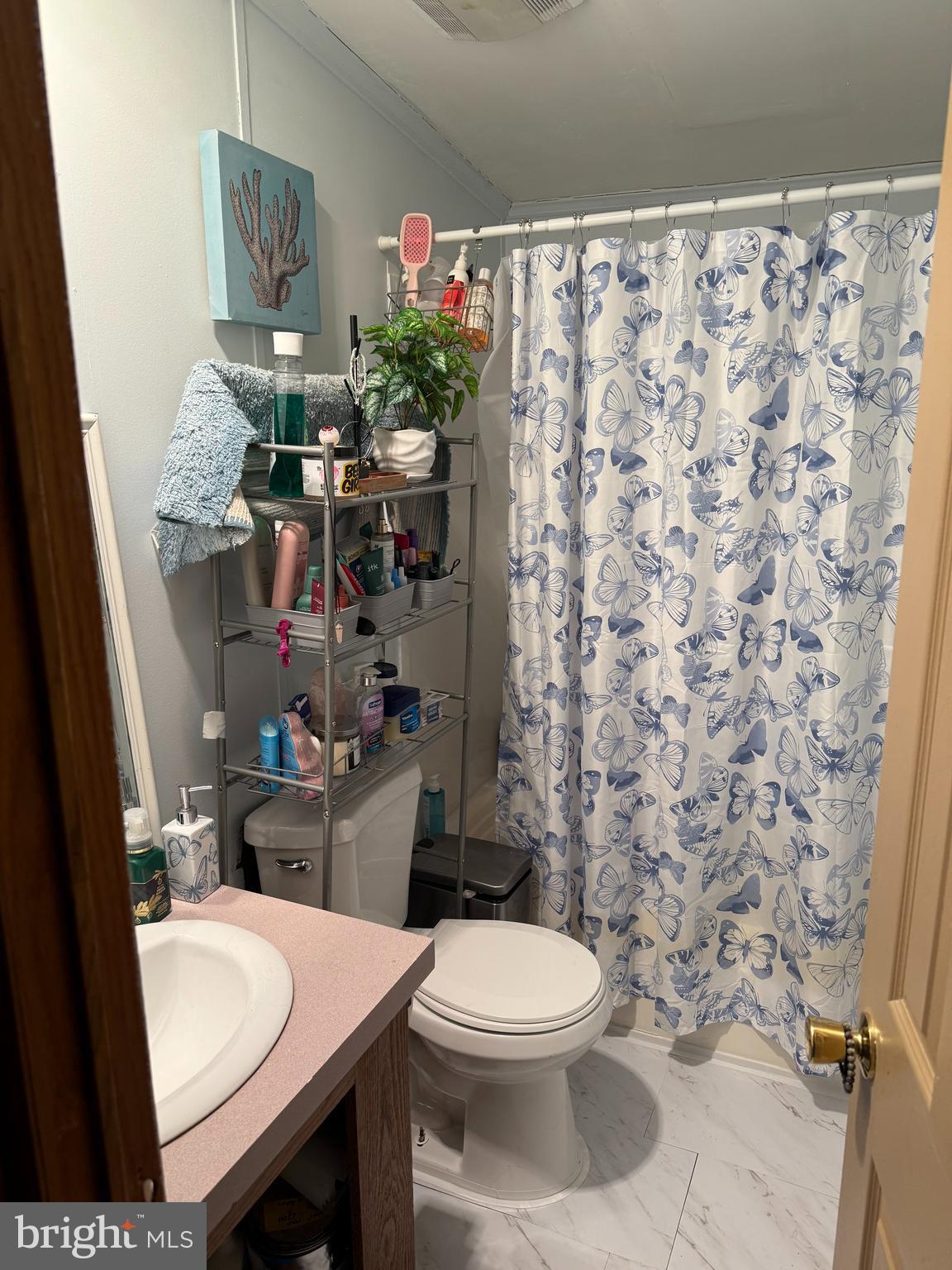938 Decoy Way, Unit A161 Bear, DE 19701 - Photo 17 of 17 a bathroom with a toilet and a shower