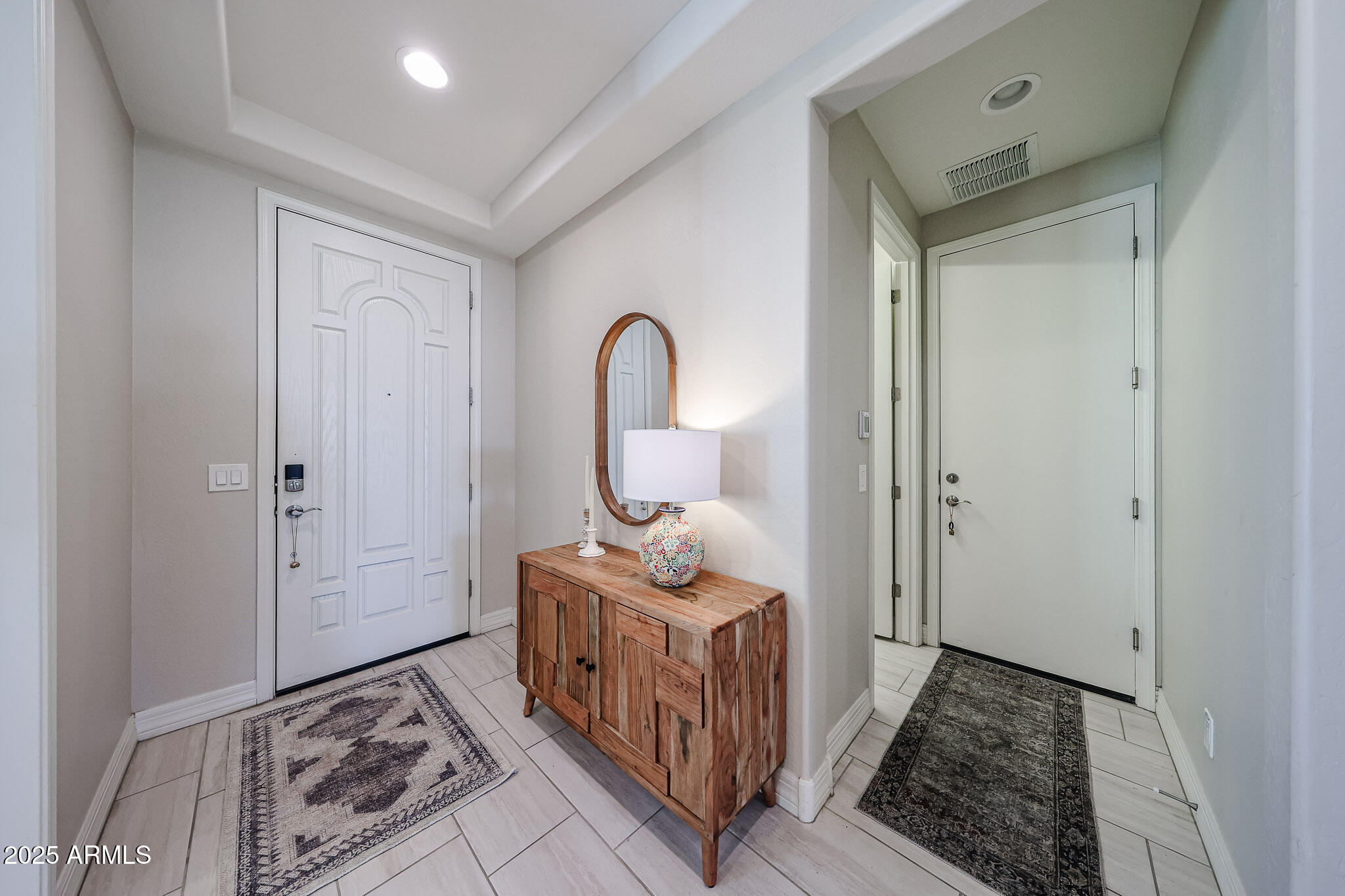 18184 West Deer Creek Road Goodyear, AZ 85338 - Photo 12 of 82 Entry/Door to Garage and Laundry