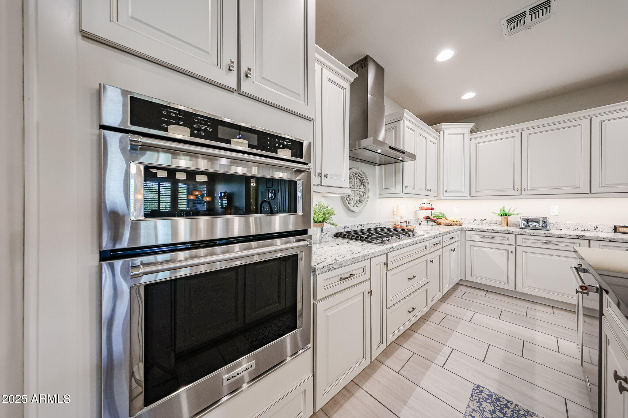 18184 West Deer Creek Road Goodyear, AZ 85338 - Photo 17 of 82 a kitchen with cabinets stainless steel appliances and sink