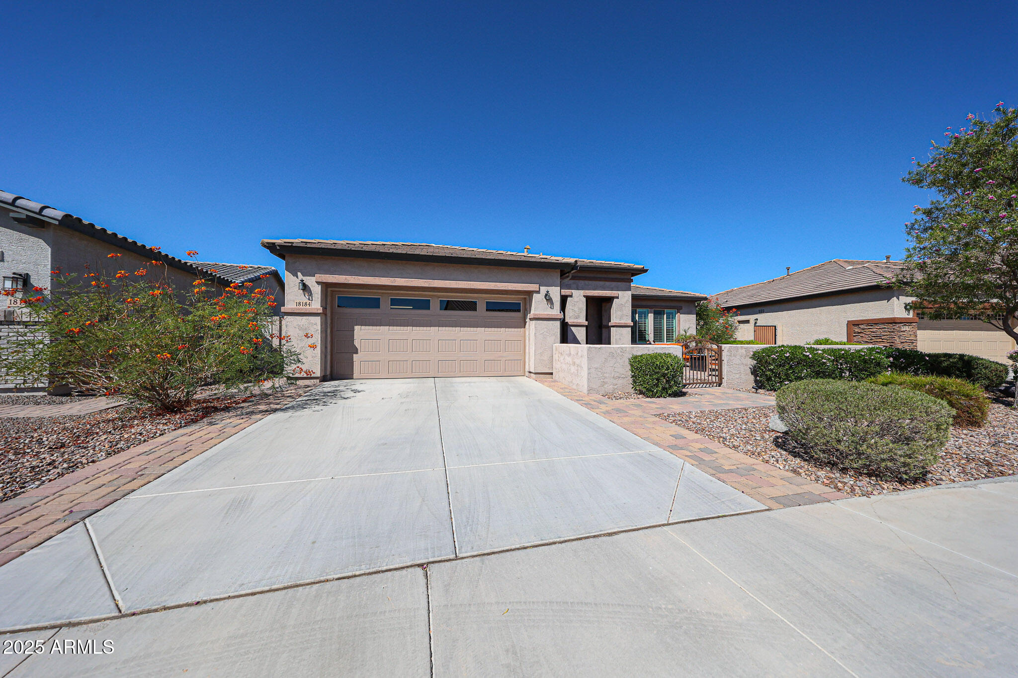 18184 West Deer Creek Road Goodyear, AZ 85338 - Photo 2 of 82 a house view with a outdoor space