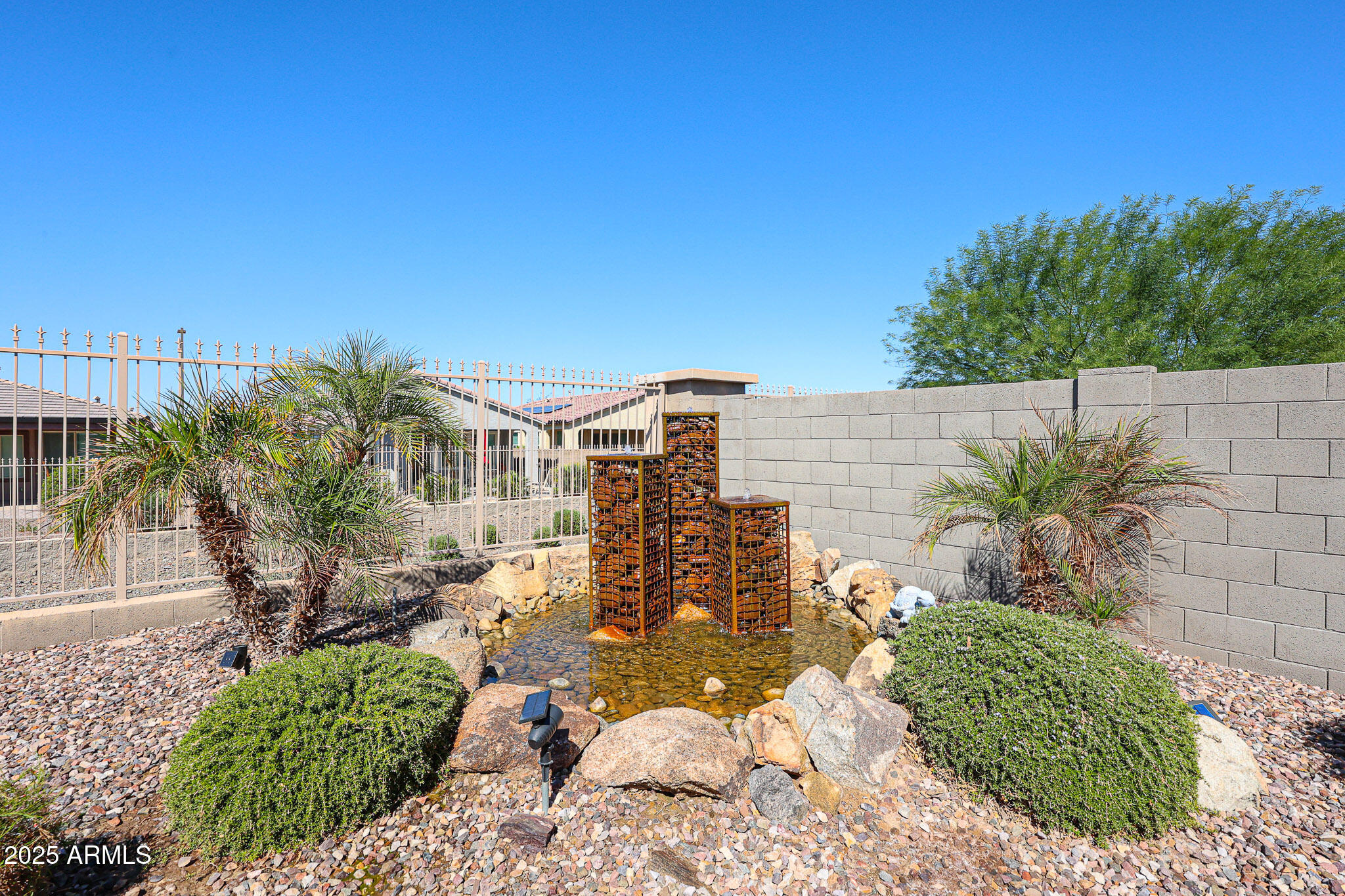 18184 West Deer Creek Road Goodyear, AZ 85338 - Photo 44 of 82 a view of a chairs and table in the patio