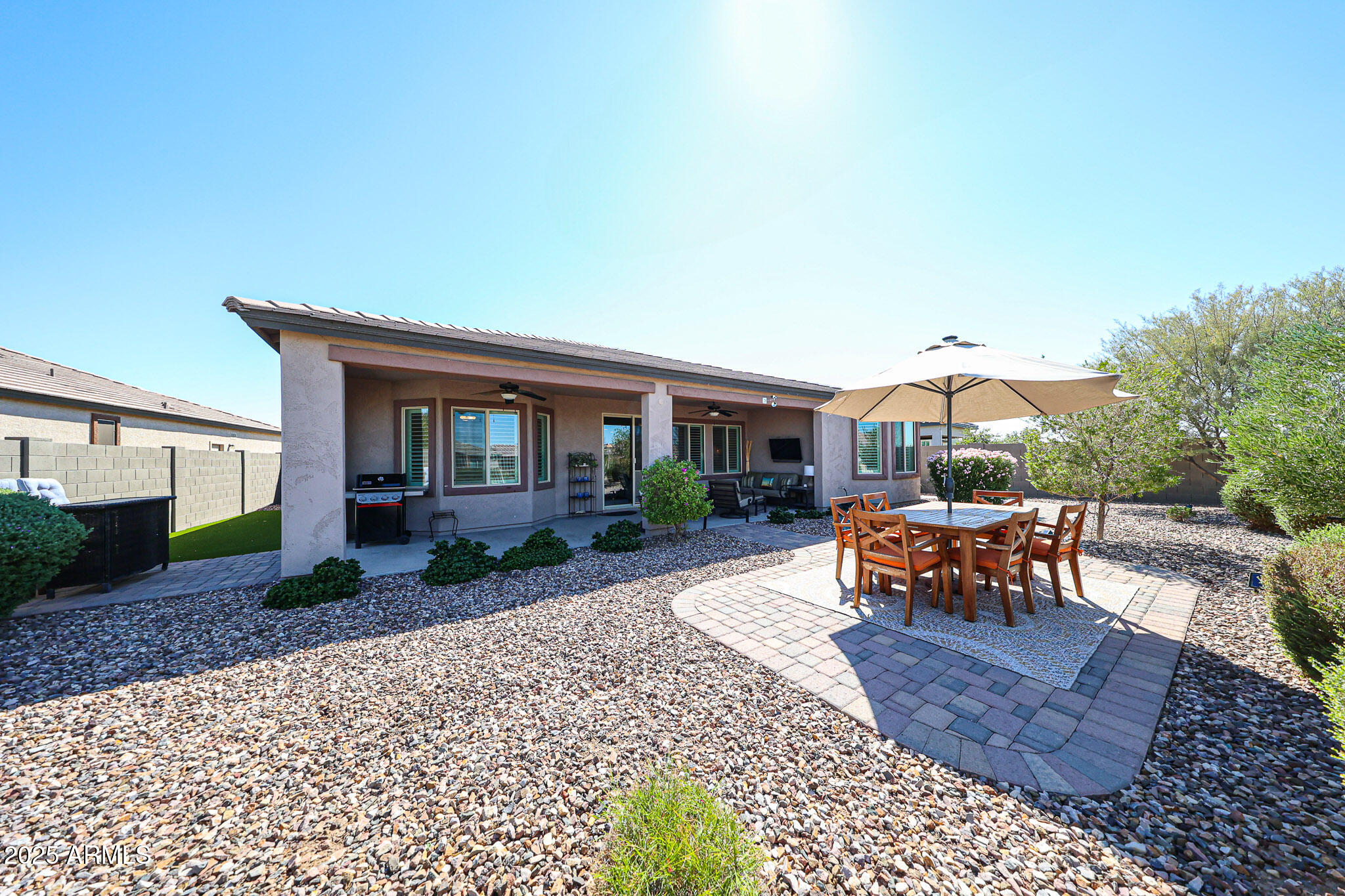 18184 West Deer Creek Road Goodyear, AZ 85338 - Photo 46 of 82 a view of a house with backyard and sitting area
