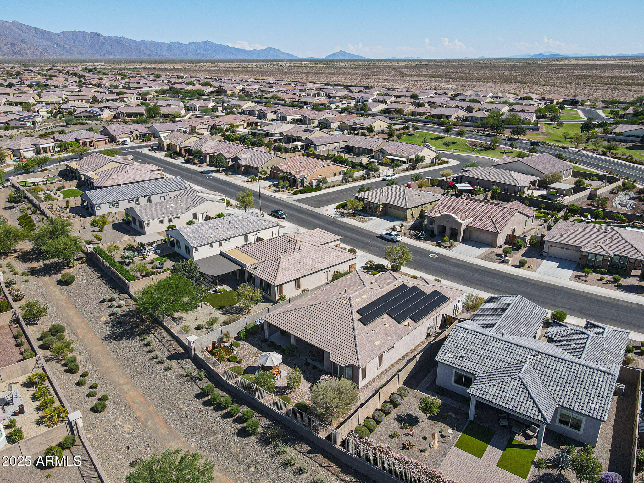 18184 West Deer Creek Road Goodyear, AZ 85338 - Photo 56 of 82 an aerial view of a city with lots of residential buildings