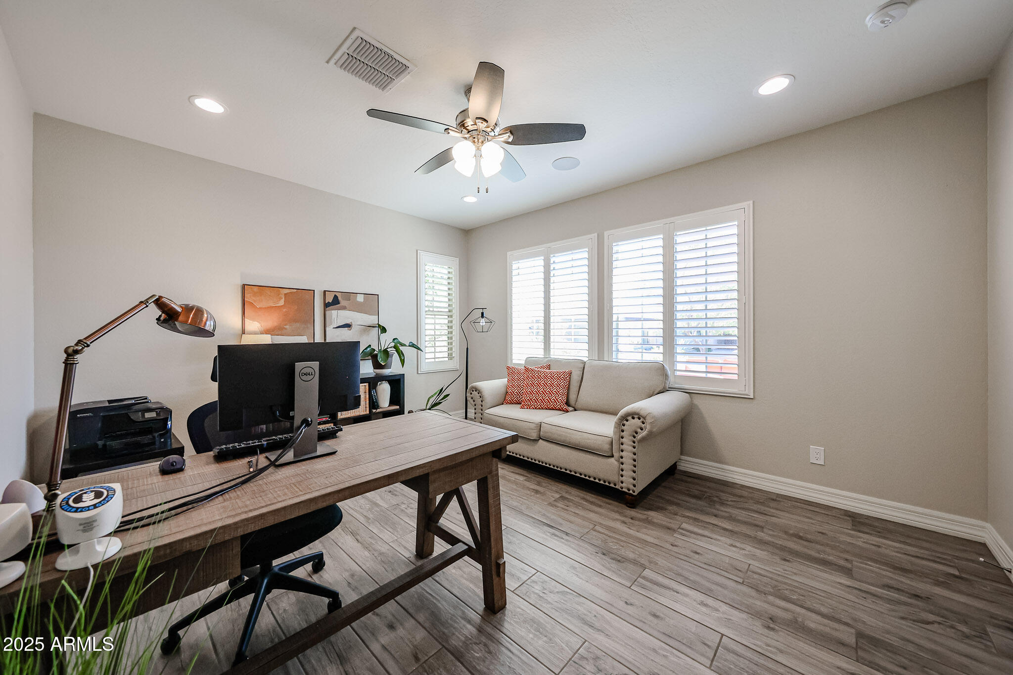 18184 West Deer Creek Road Goodyear, AZ 85338 - Photo 9 of 82 a view of a workspace with furniture and a window