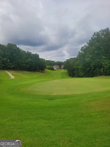 a view of a green field with clear sky