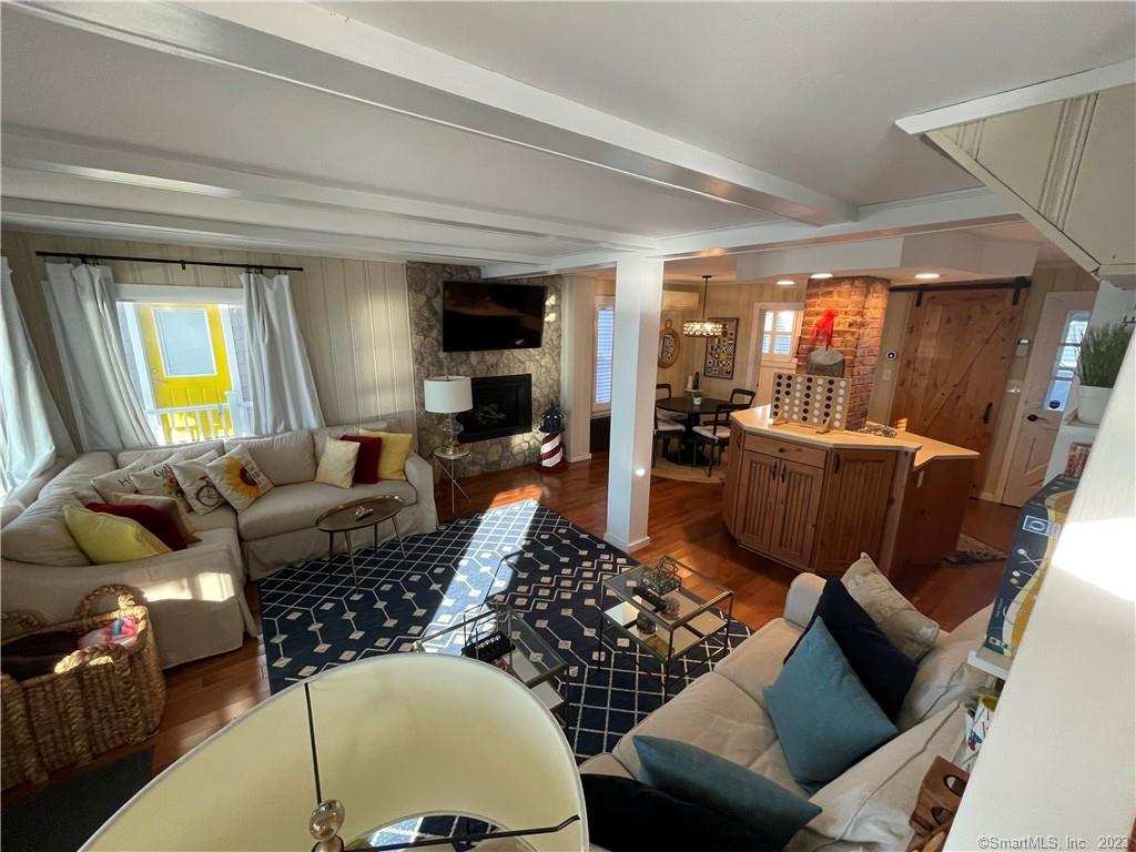59 Melba Street Milford, CT 06460 - Photo 14 of 38 a living room with furniture fireplace and a large window