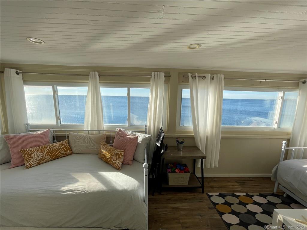 59 Melba Street Milford, CT 06460 - Photo 18 of 38 a bedroom with furniture and a large window