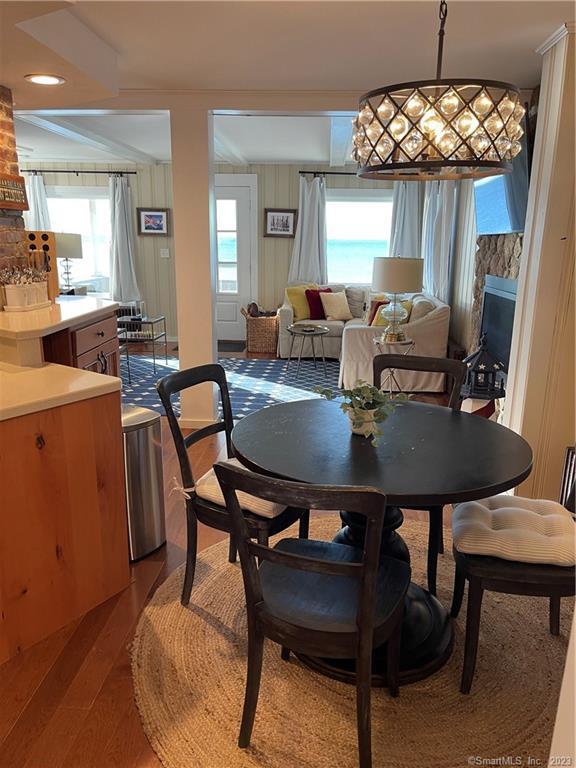 59 Melba Street Milford, CT 06460 - Photo 21 of 38 a view of a dining room with furniture and chandelier