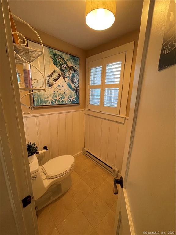 59 Melba Street Milford, CT 06460 - Photo 23 of 38 a bathroom with a sink and tub