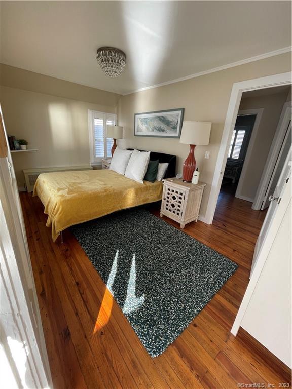 59 Melba Street Milford, CT 06460 - Photo 26 of 38 a bedroom with wooden floor and furniture