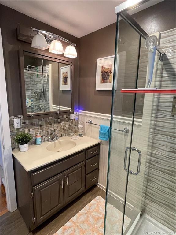 59 Melba Street Milford, CT 06460 - Photo 31 of 38 a bathroom with a sink and mirror