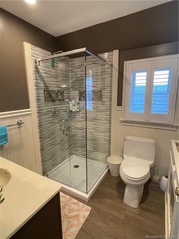 59 Melba Street Milford, CT 06460 - Photo 32 of 38 a bathroom with a shower toilet and a sink